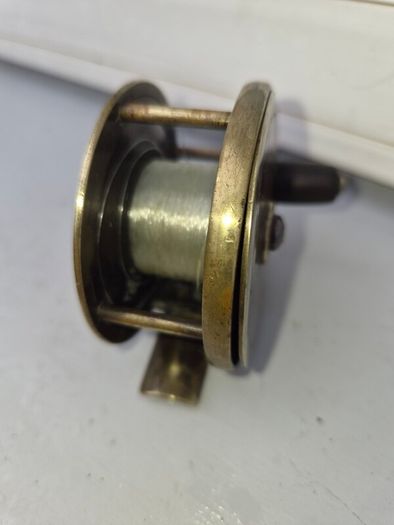 old  brass  fishing real