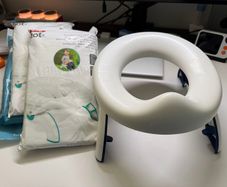 Oxo travel potty potty training foldable with 100 disposable bags