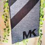 Authentic Michael Kors reversible knit scarf in charcoal black/heather grey with oversized MK logo detail. Image 3