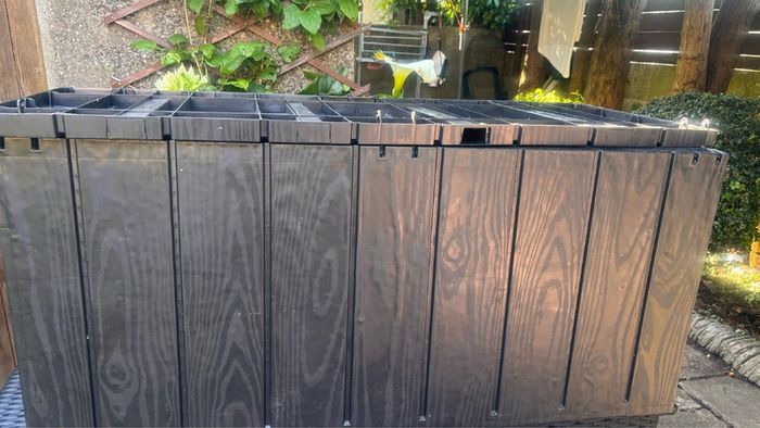 Outdoor cushion storage box
