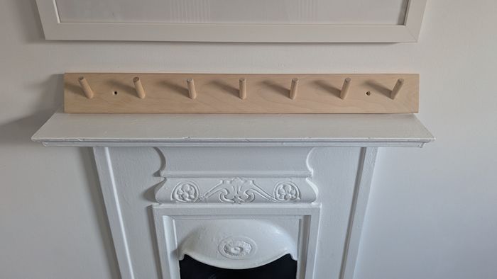 Peg rail coat rack