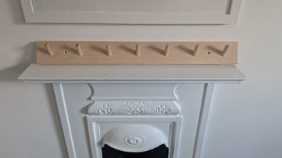Peg rail coat rack
