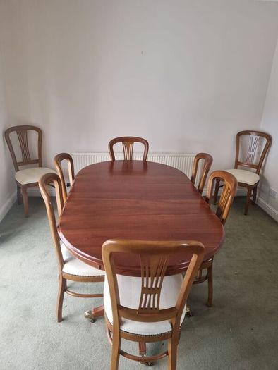 Cherry wood dining table and 8 chairs