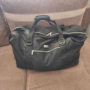 Large black expandable travel bag with shoulder strap