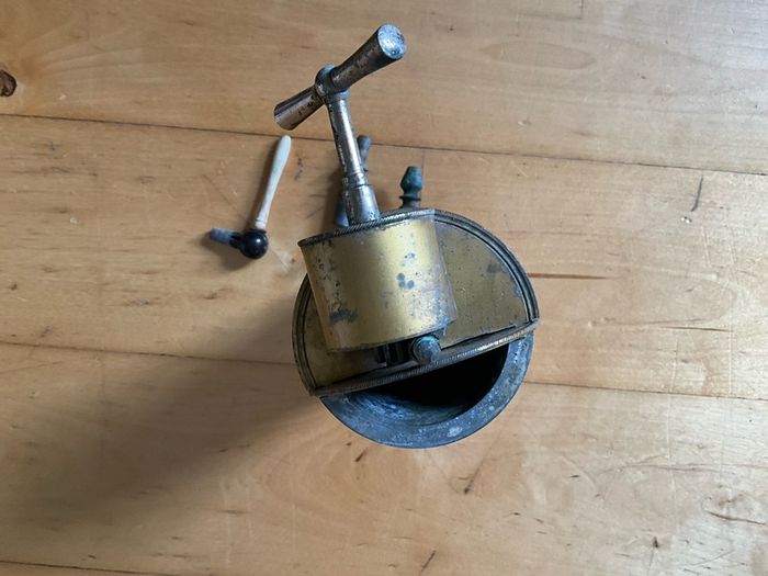 This is an antique  Dr. Eguisier brass irrigator, a medical instrument patented in 1843.