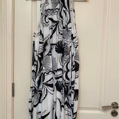 Black and white patterned pleated halter neck dress