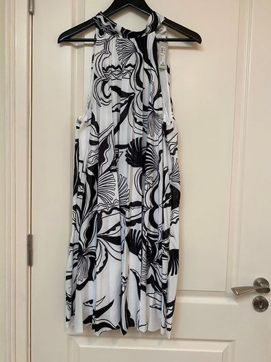 Black and white patterned pleated halter neck dress