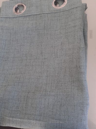 As new green linen curtains .Size 56"width x 82"length .A lot brighter than the pics .Just hung for a few days but dont go in the room .Unlined but heavy .Ringtop 12 euro .