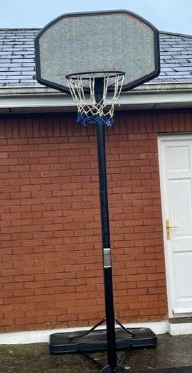 Portable Basketball Stand- Adjustable. stored in garage when not in use. In Very Good Condition.