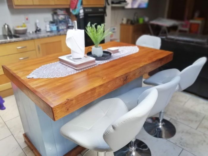 Rustic kitchen island with overhang