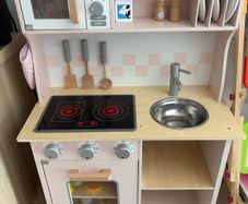 Little girls pink wooden kitchen