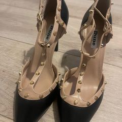 brand New shoes never worn as the heel is to high for me & I just can't walk in them!