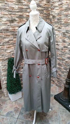Vintage Nuage ladies trenchcoat Approximately late 90s early 00s Size 10 on label The colour is a pale bluey grey with brown buttons It's got an inner lining that can be removed