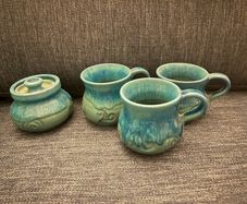 ceramic mugs and sugar bowl