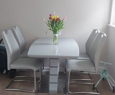 greay extending dining table and 4 chairs