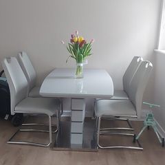 greay extending dining table and 4 chairs
