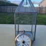 Table clock in a glass lantern. Image 6