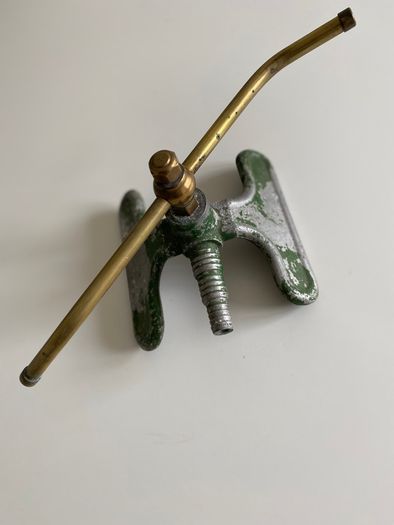Antique revolving garden sprinkler
