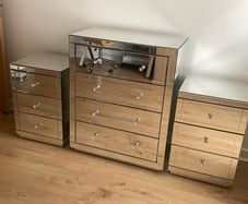 A set of modern mirrored bedroom furniture