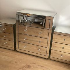 A set of modern mirrored bedroom furniture