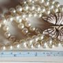 A beautiful faux pearl butterfly bracelet. Image 2