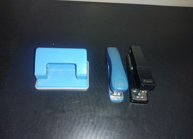 1 Hole Punch and 2 staplers