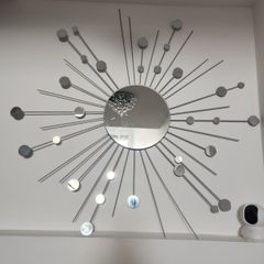 Elegant Silver Starburst Mirror