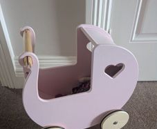 Pink moover dolls wooden pram