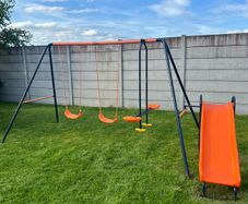 Swing set with slide and seesaw