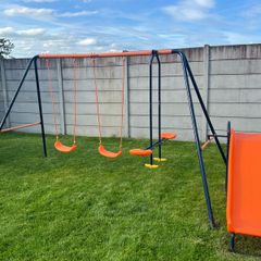 Swing set with slide and seesaw
