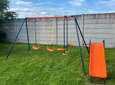 Swing set with slide and seesaw