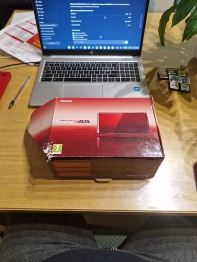 Nintendo 3DS Metallic Red with the original box, charger, and booklets