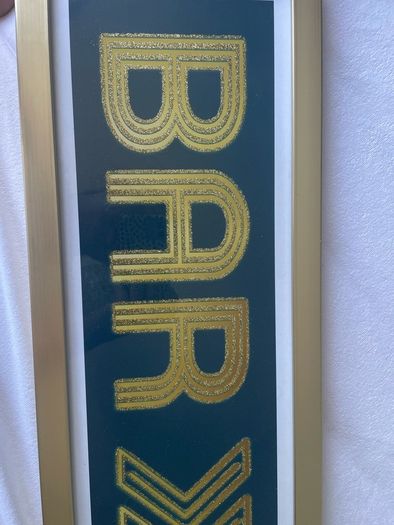 Gold framed bar sign