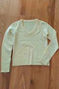 Women's yellow v-neck jumper