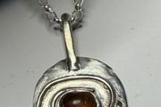 Handmade sterling silver pendant with amber stone