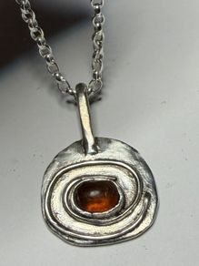 Handmade sterling silver pendant with amber stone