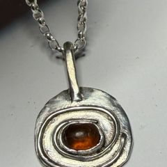 Handmade sterling silver pendant with amber stone