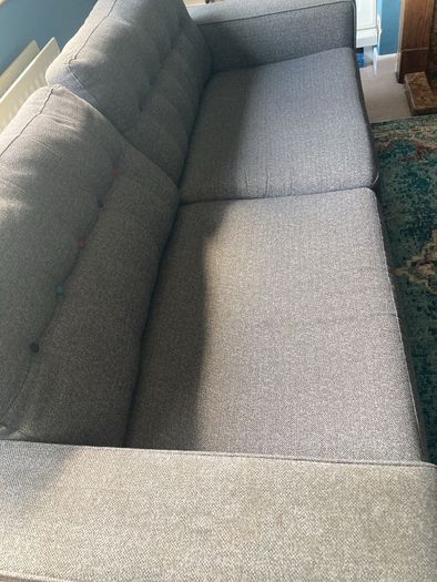 Grey DFS sofa and matching footstool