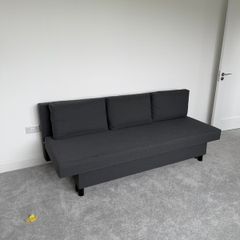 Dark grey sofa bed with storage