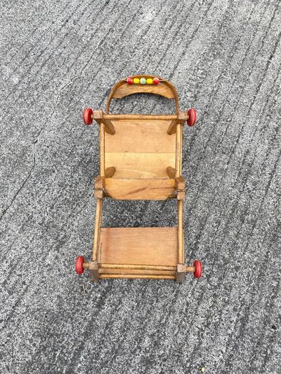 Vintage wooden doll high chair FROM THE 1930S featuring a built-in play tray with a wire bead