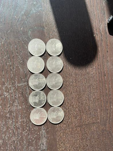 Ten Millennium Pound coins