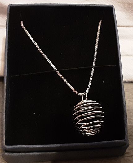 selection of homemade white metal necklaces
