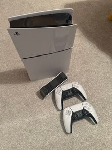 PlayStation 5 Slim with two controllers and charging station