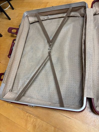 Vintage burgundy faux-leather suitcase