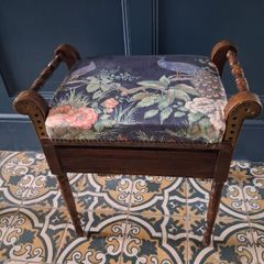 Antique piano stool upholstered in peacock fabric