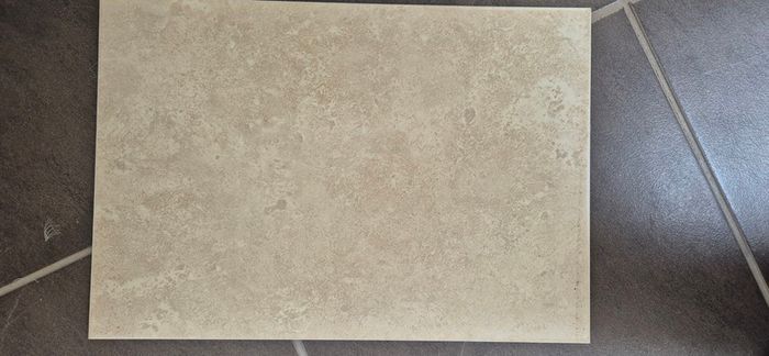 Beige stone-effect ceramic wall tiles