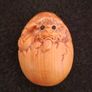 Carved wooden dragon hatching from an egg. Image 6