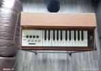 Vintage electric organ on stand