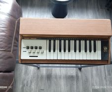 Vintage electric organ on stand