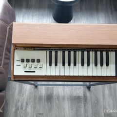 Vintage electric organ on stand